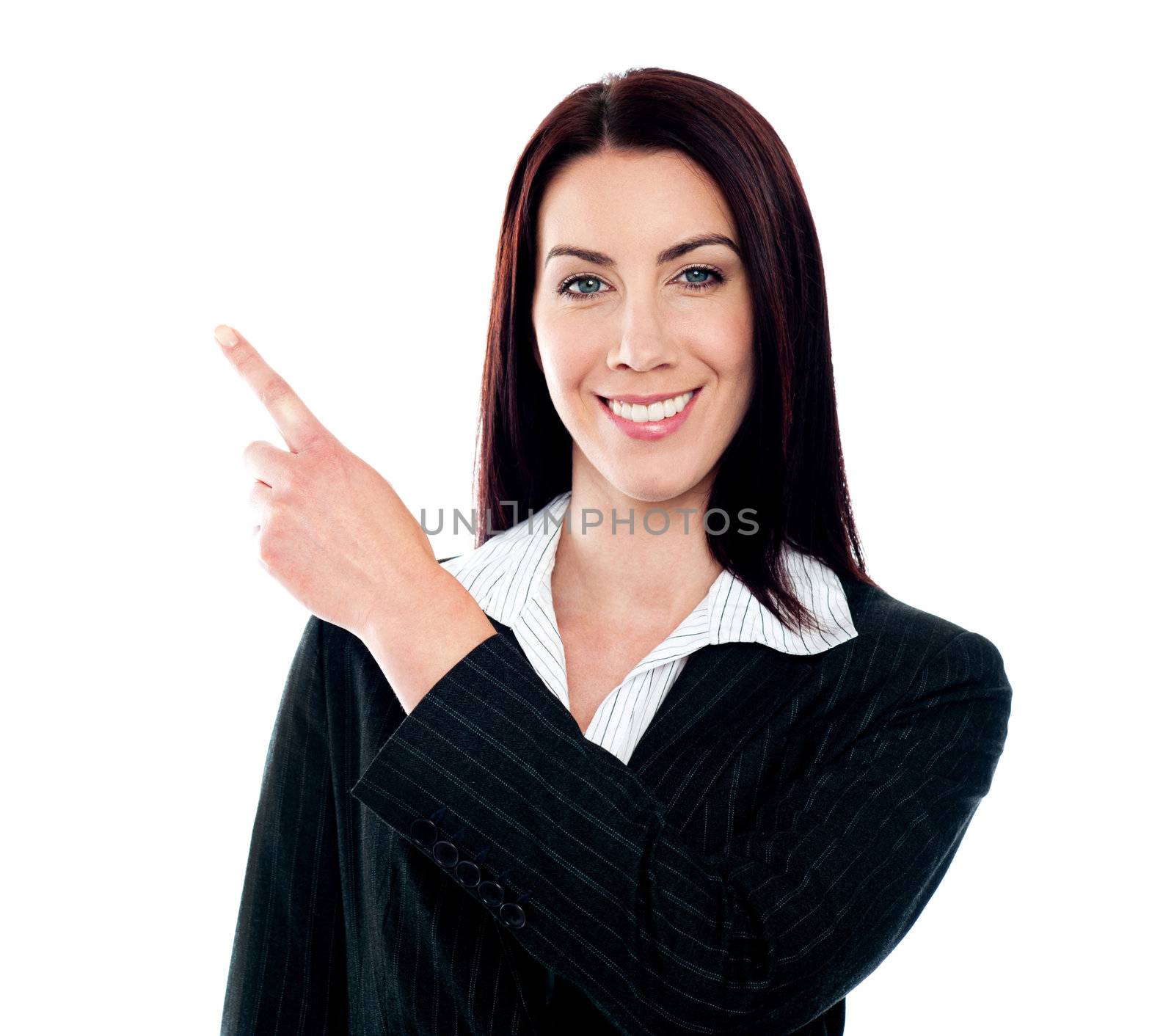 Business lady pointing at copyspace isolated over white