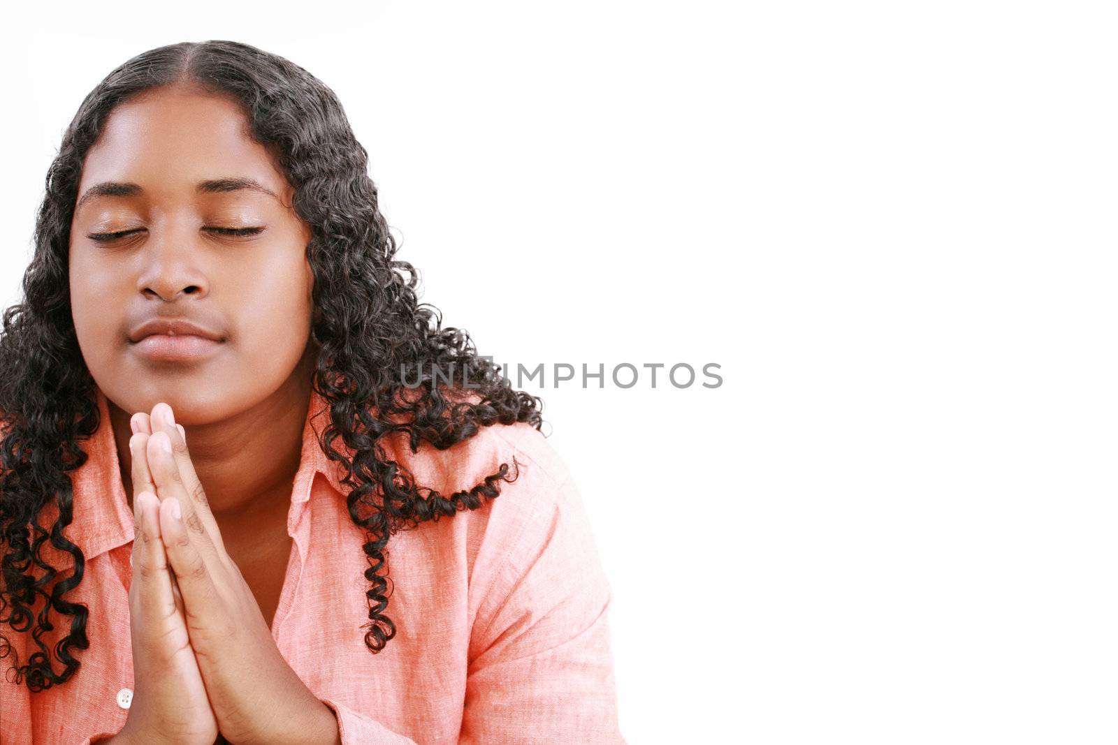 woman praying isolated on a white background. by dacasdo