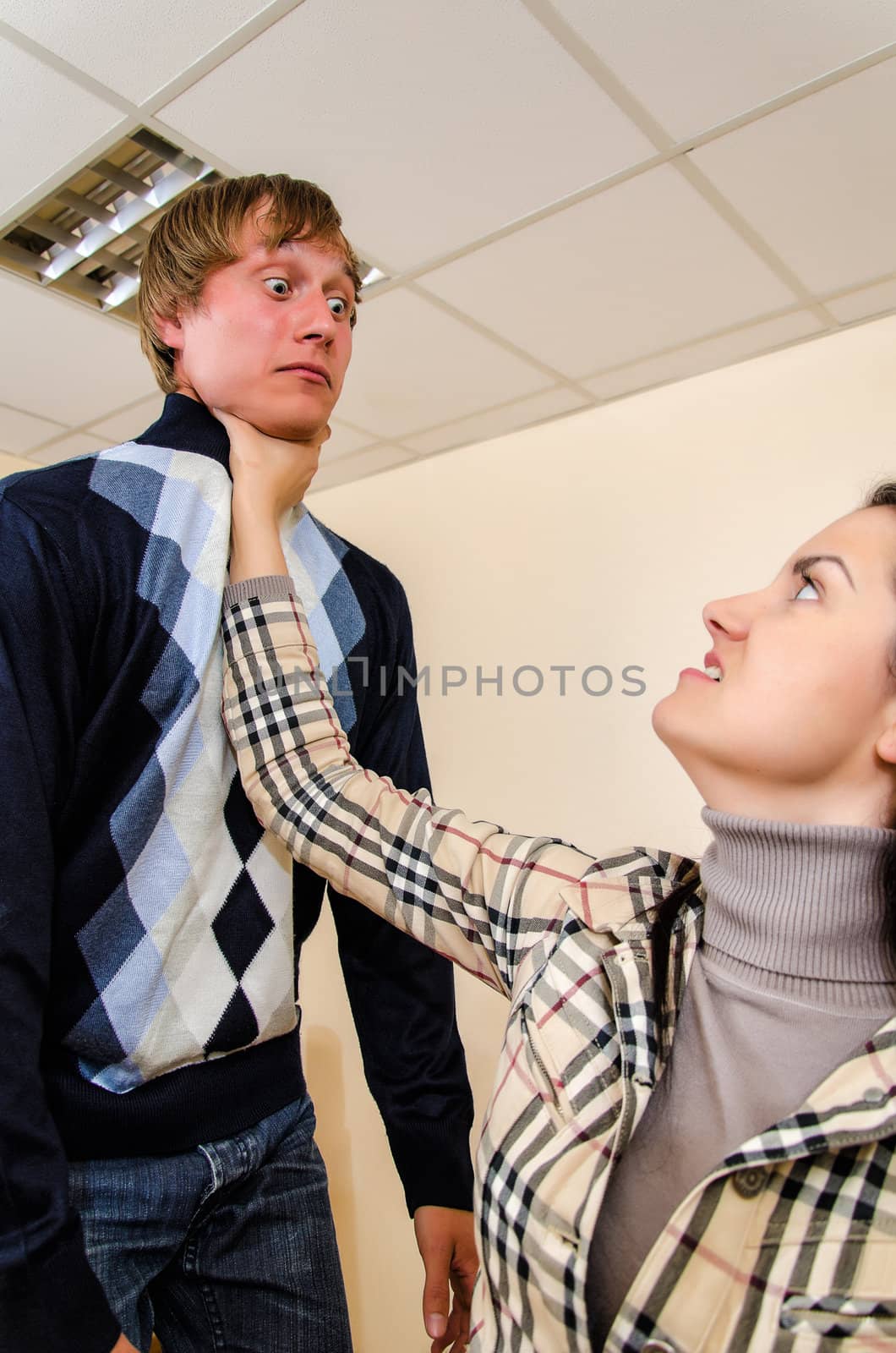 Office fight: Woman trying to stifle a man