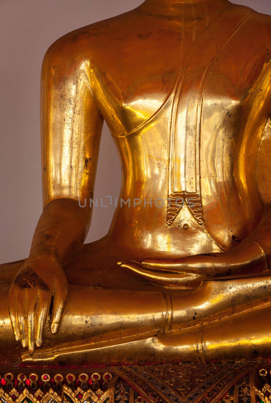 Sitting Buddha statue close up details. Wat Pho temple, Bangkok, Thailand