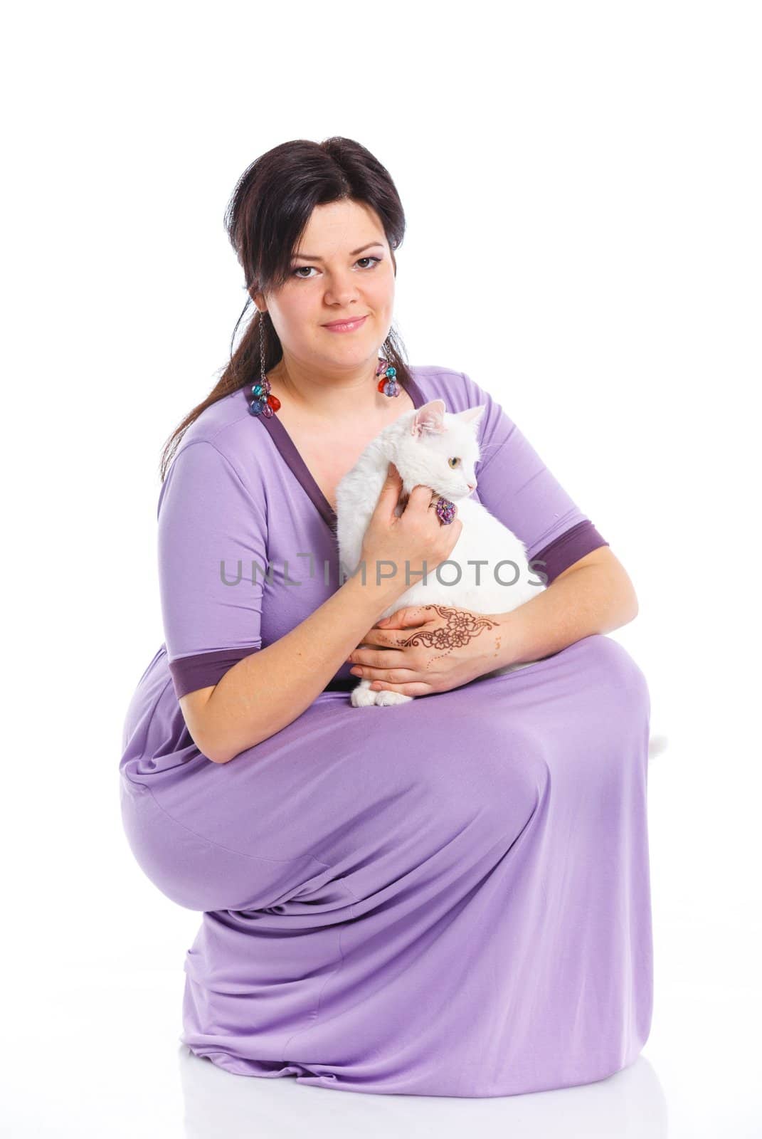 Young pretty woman hold her lovely white cat. Isolated on a white background