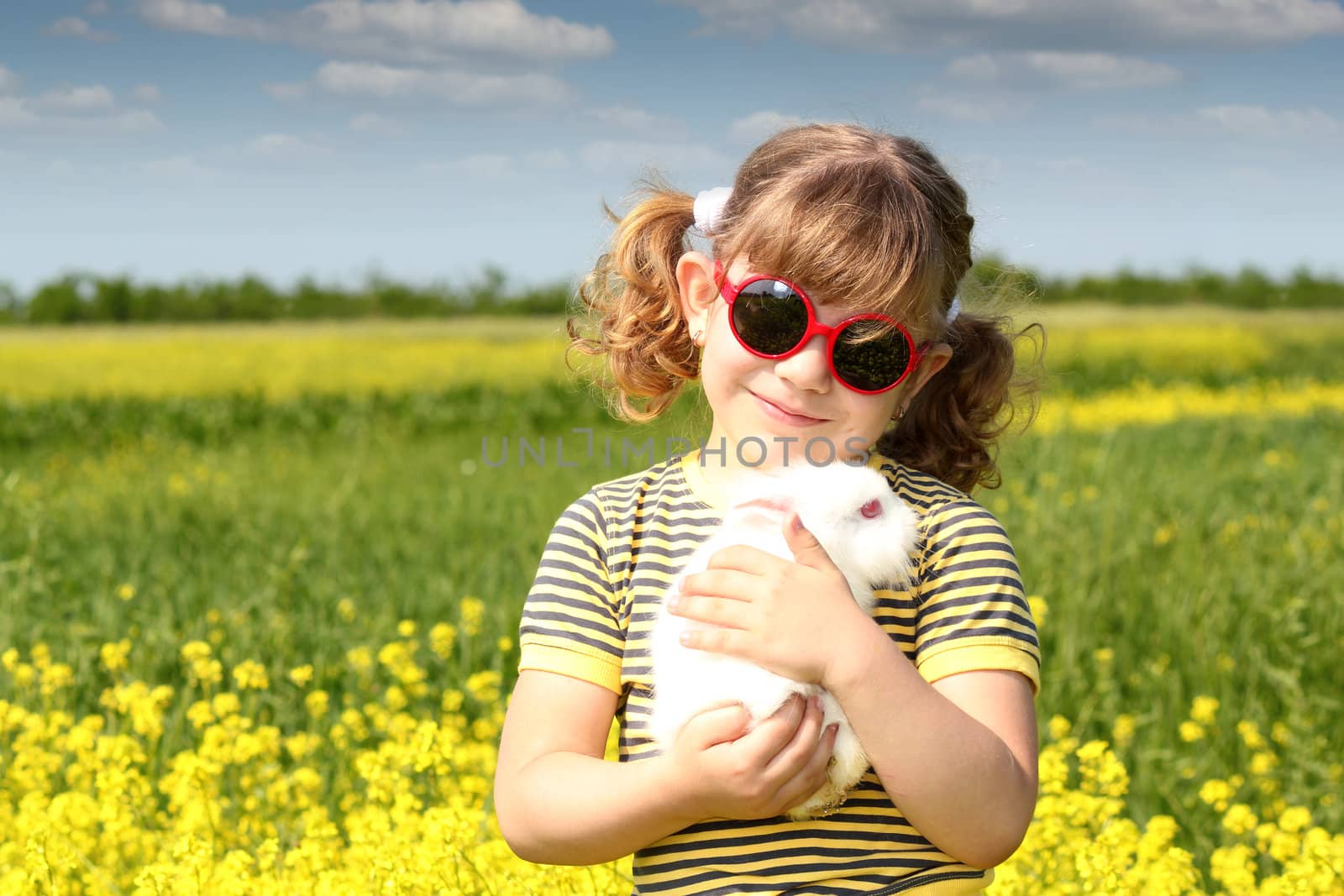 little girl with bunny pet