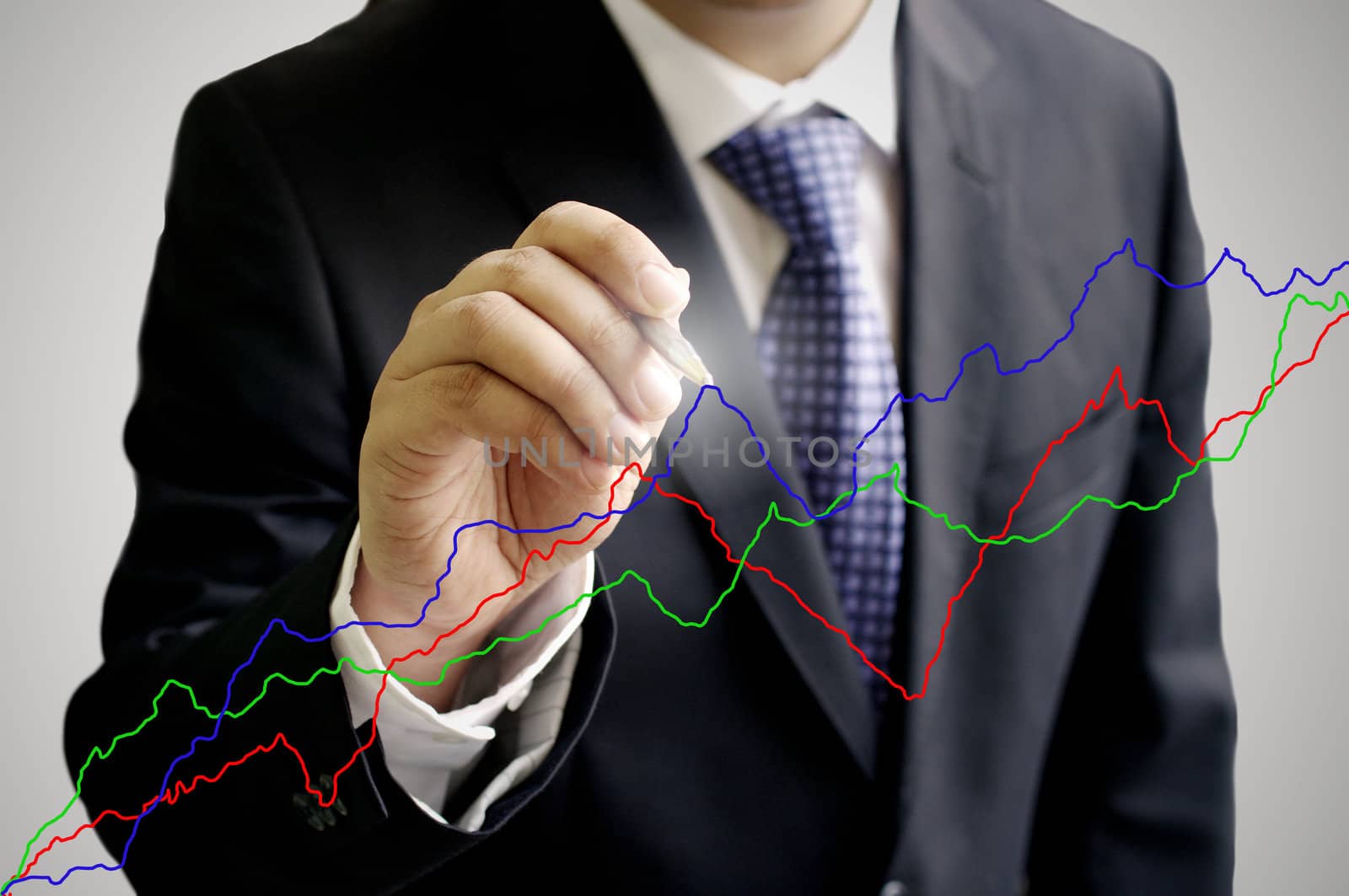 Businessman analyze the stock exchange graph by pixbox77