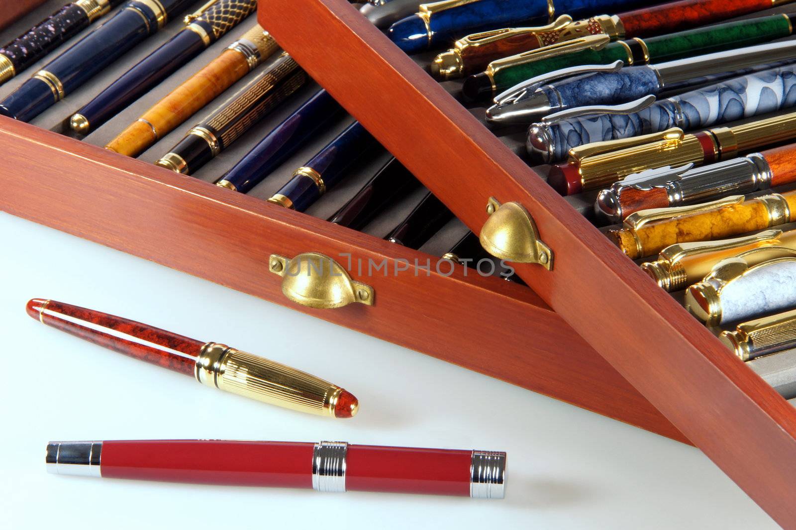 Collection of pens with two out of the file drawer