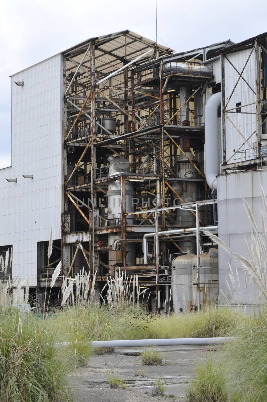 Old and Rusted Factory with some grass tuft