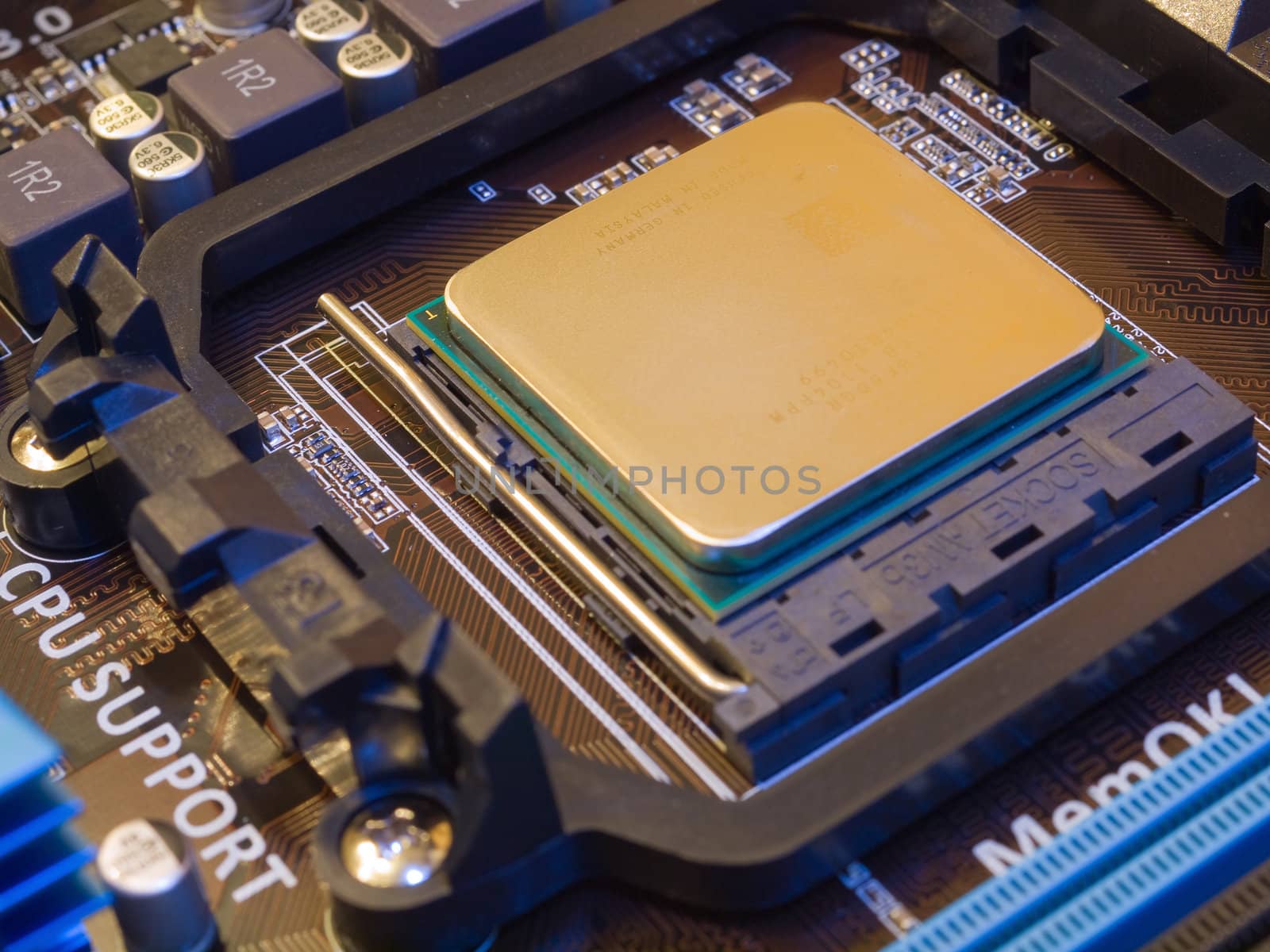 CPU socket on motherboard with installed CPU by kvinoz