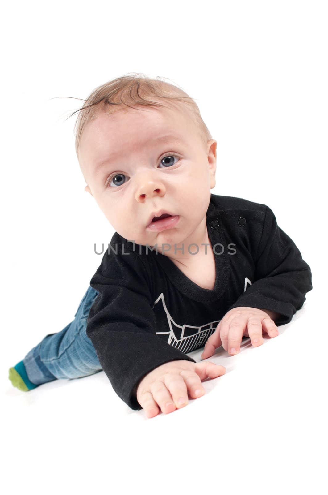 Shot of little baby lying on white background