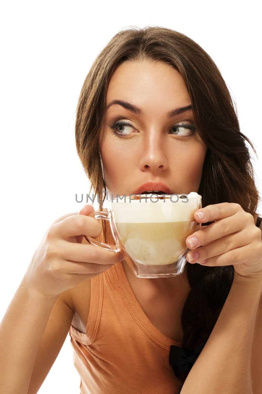 beautiful woman drinking cappuccino coffee looking to side on white background