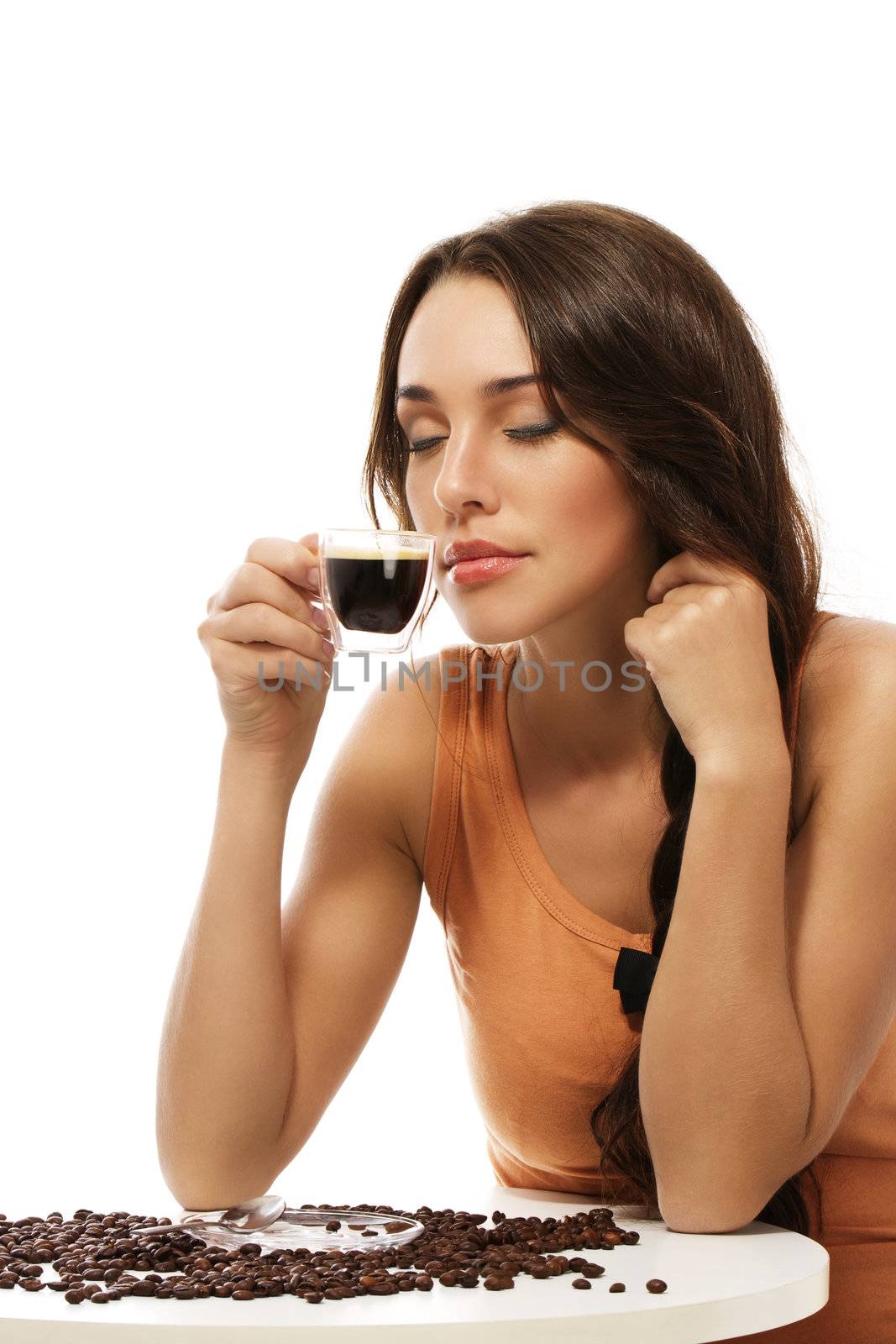 beautiful woman scenting on espresso coffee on white background