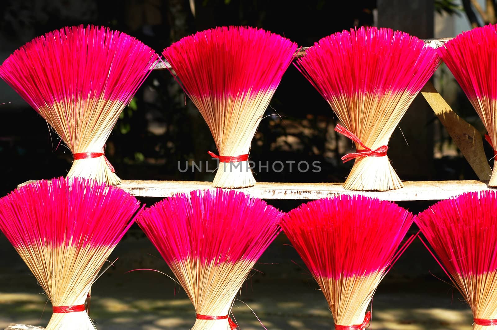 Red incense or joss sticks for buddhist prayers in Vietnam 