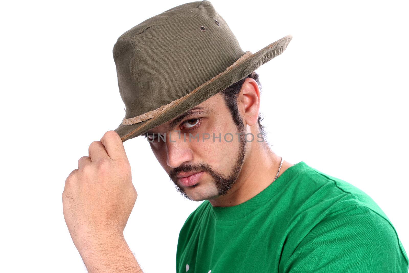 A cool Indian guy wearing a hat, on white studio background.
