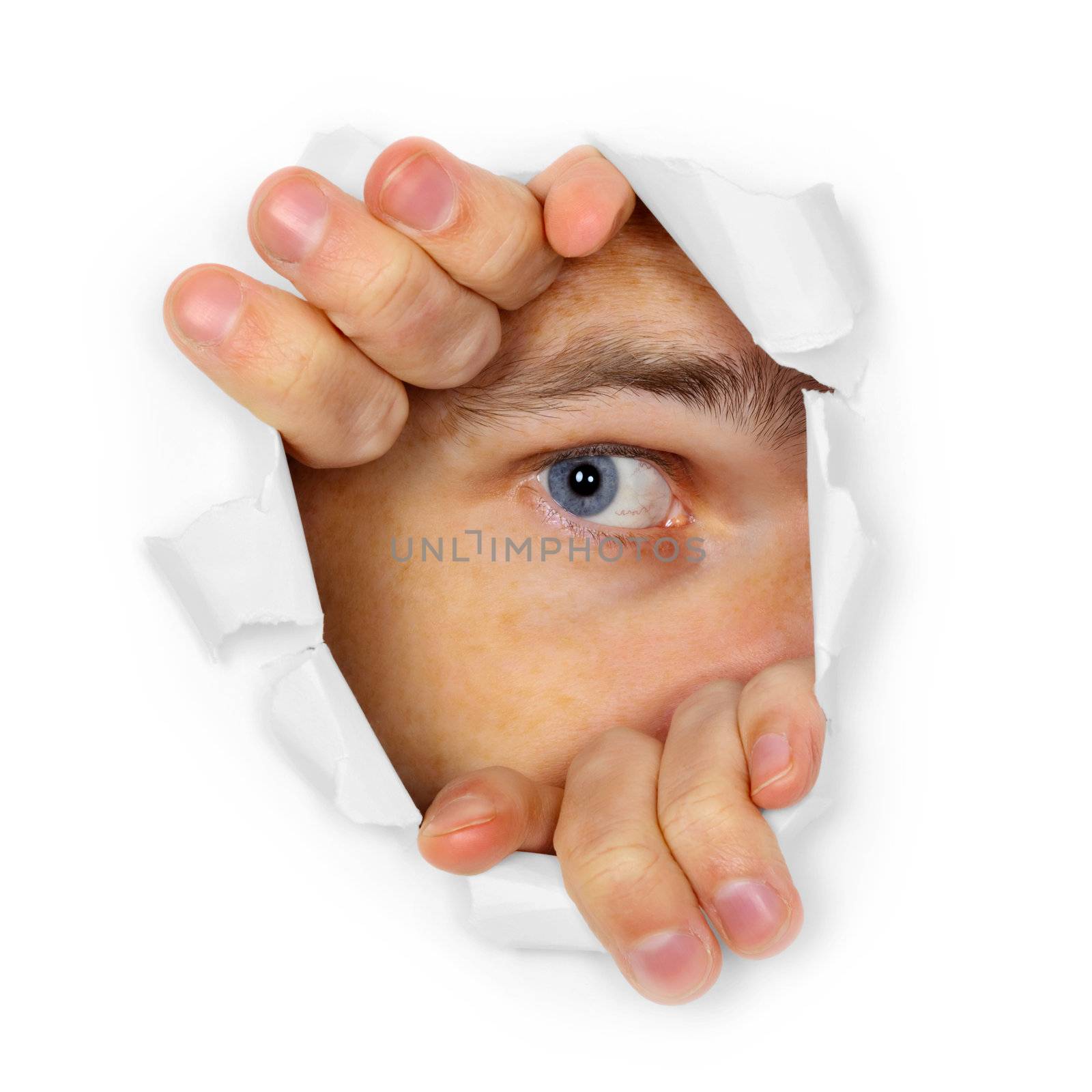 A man watches through a hole in the paper