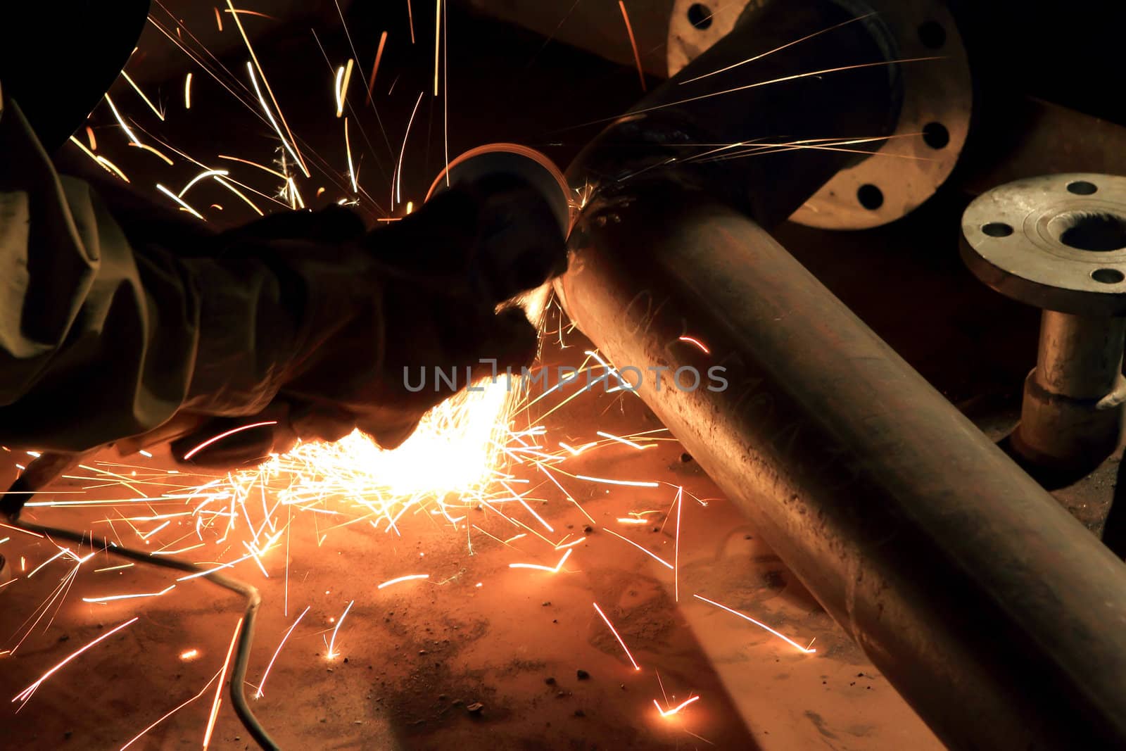 Welder in a factory 
 by rufous