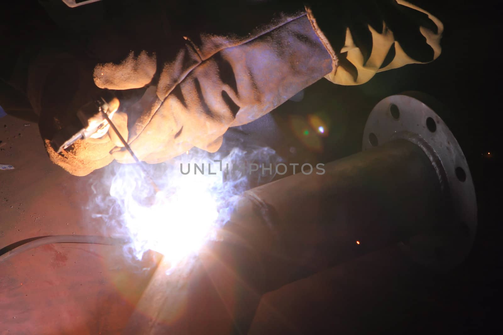 Welder in a factory 
 by rufous