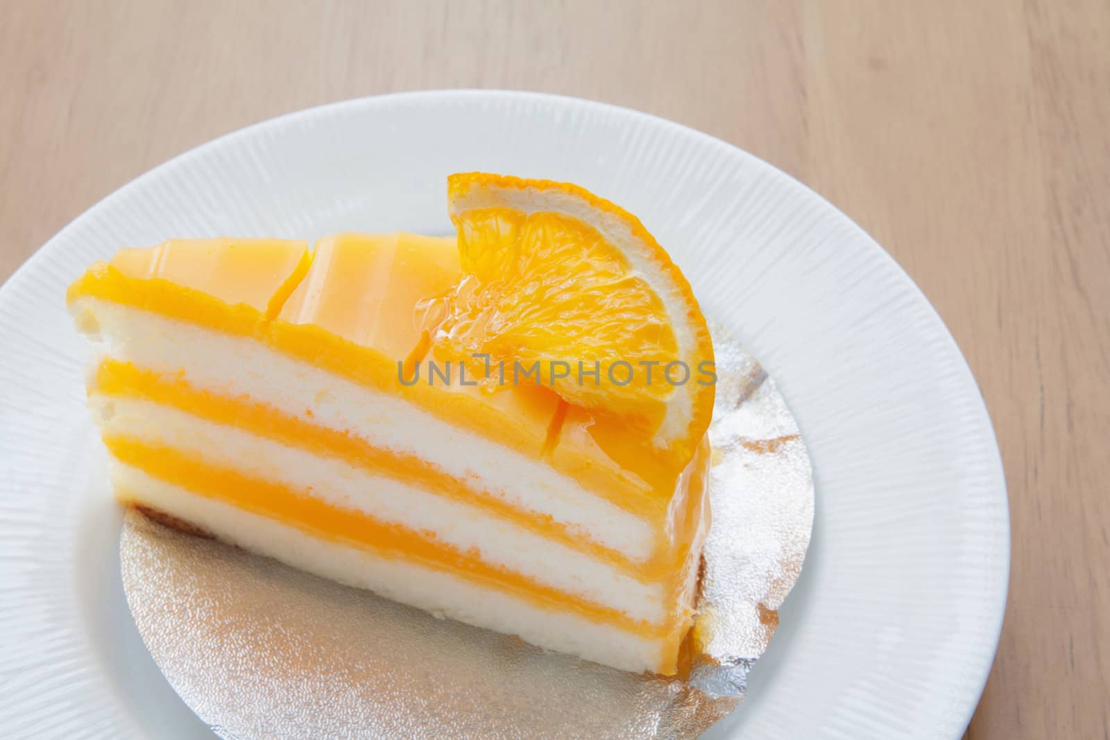 Orange cake on the wood background