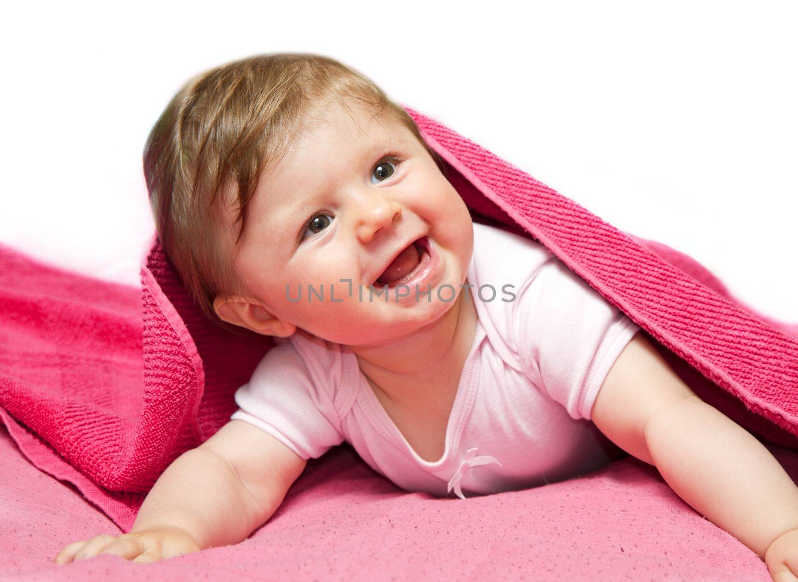 An adorable, laughing baby looking at camera