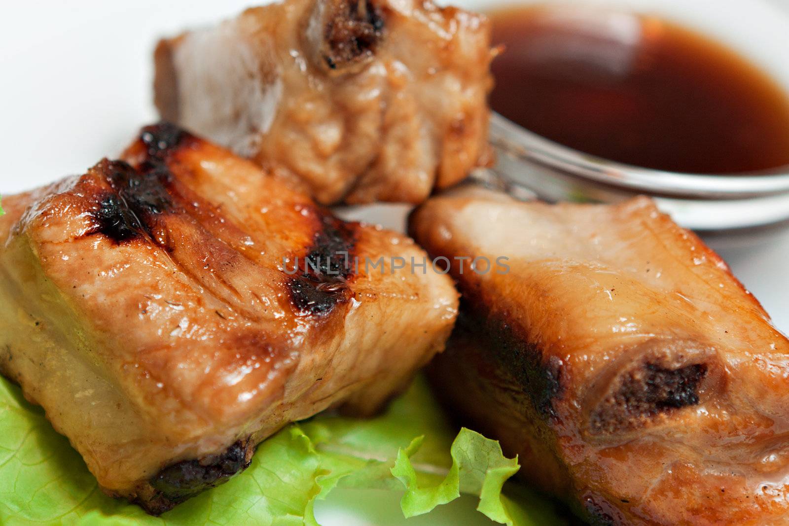 pieces of cooked meat closeup by nigerfoxy