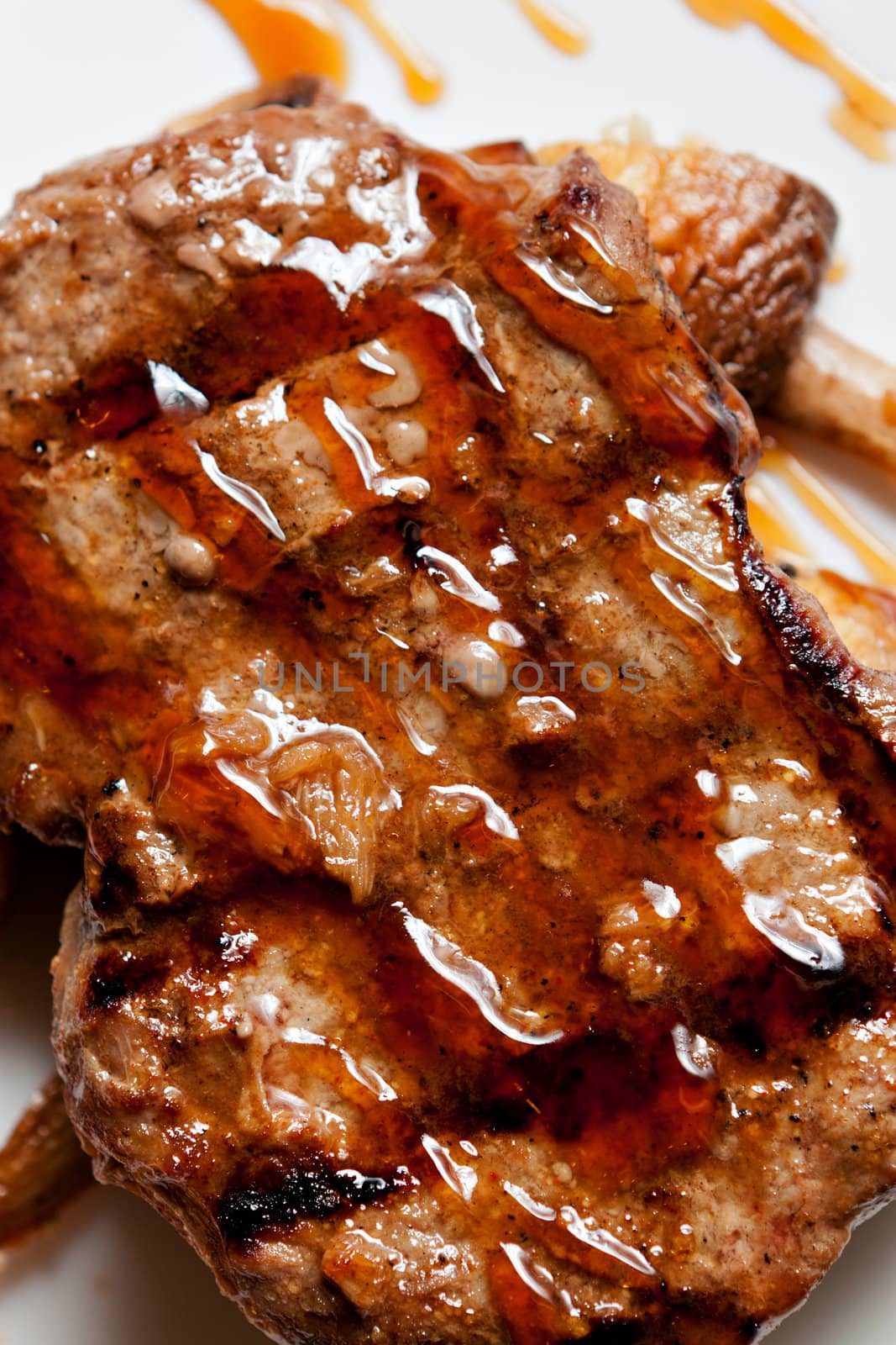 Grilled meat closeup on a white background.