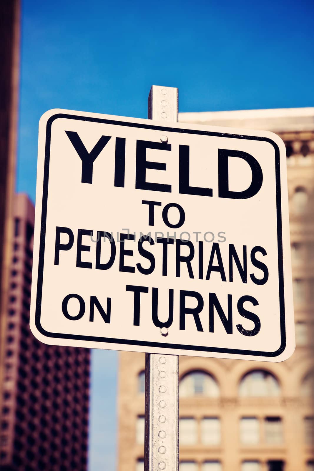 Yield on pedestrians on turns sing in the center of Boston, Massachusetts