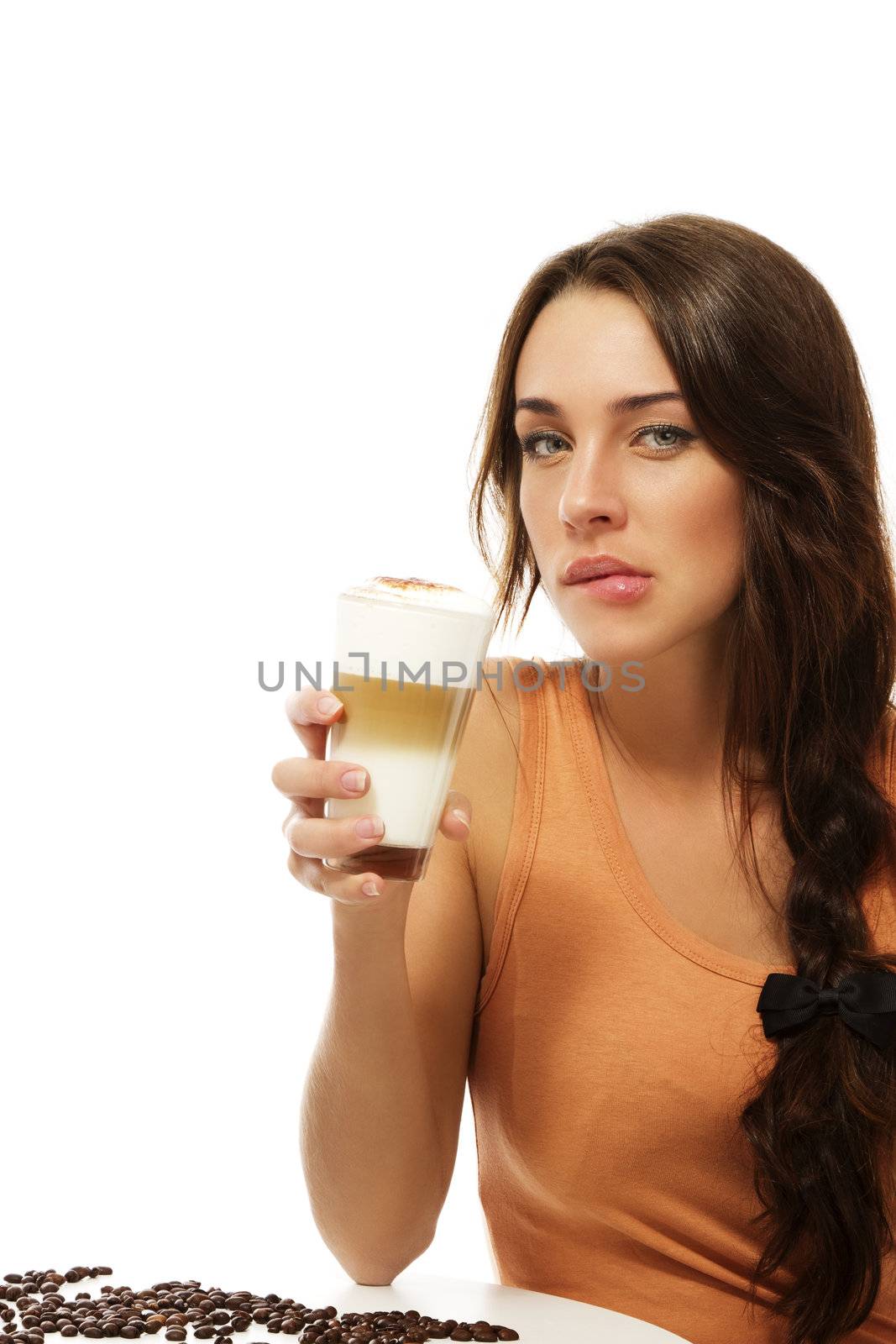 beautiful woman with latte macchiato coffee bites on her lips on white background