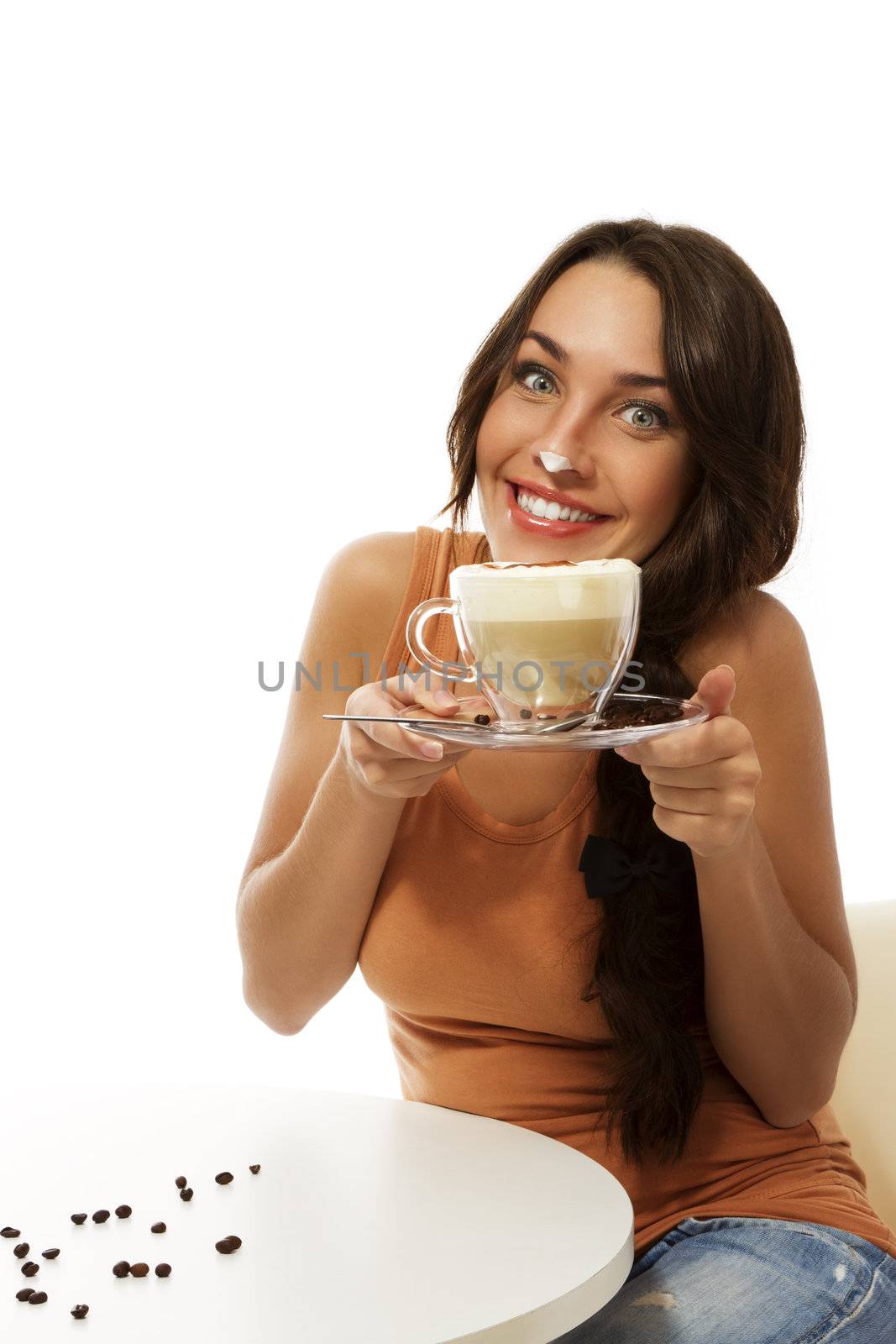 young woman with cappuccino coffee has milk foam on her nose by RobStark