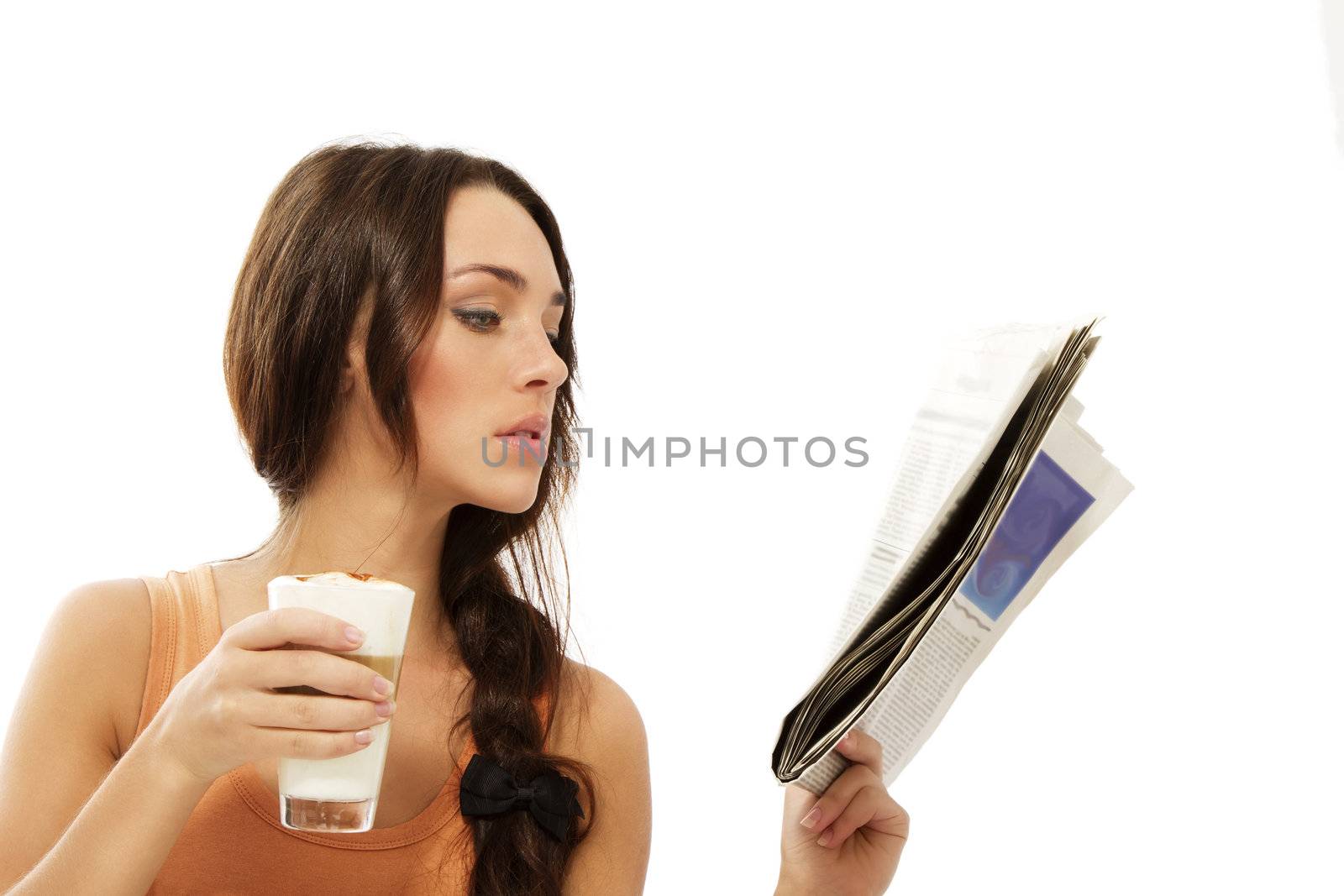 young woman reading newspaper holding latte macchiato coffee on white background