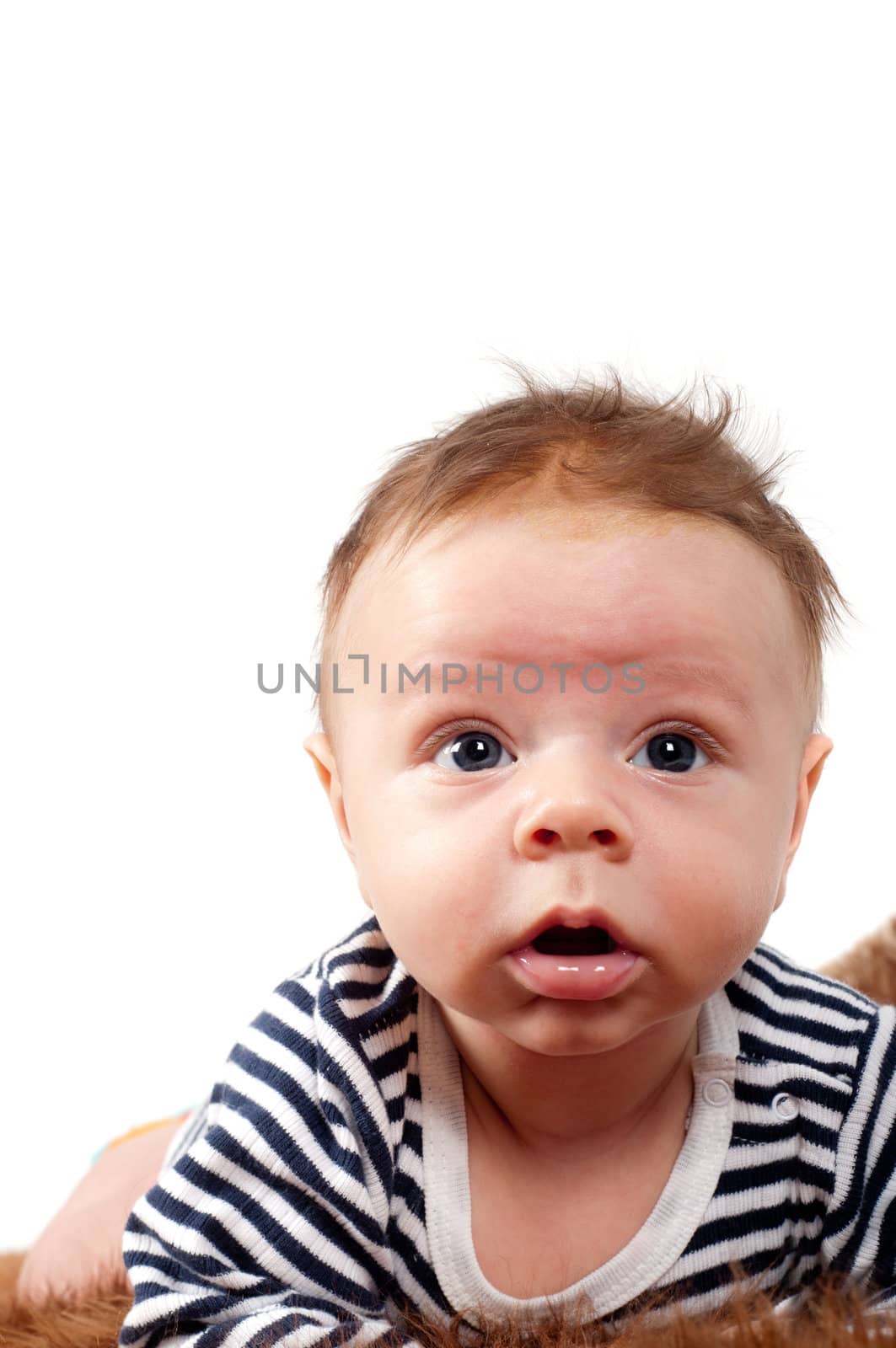 Shot of newborn baby lying on fur