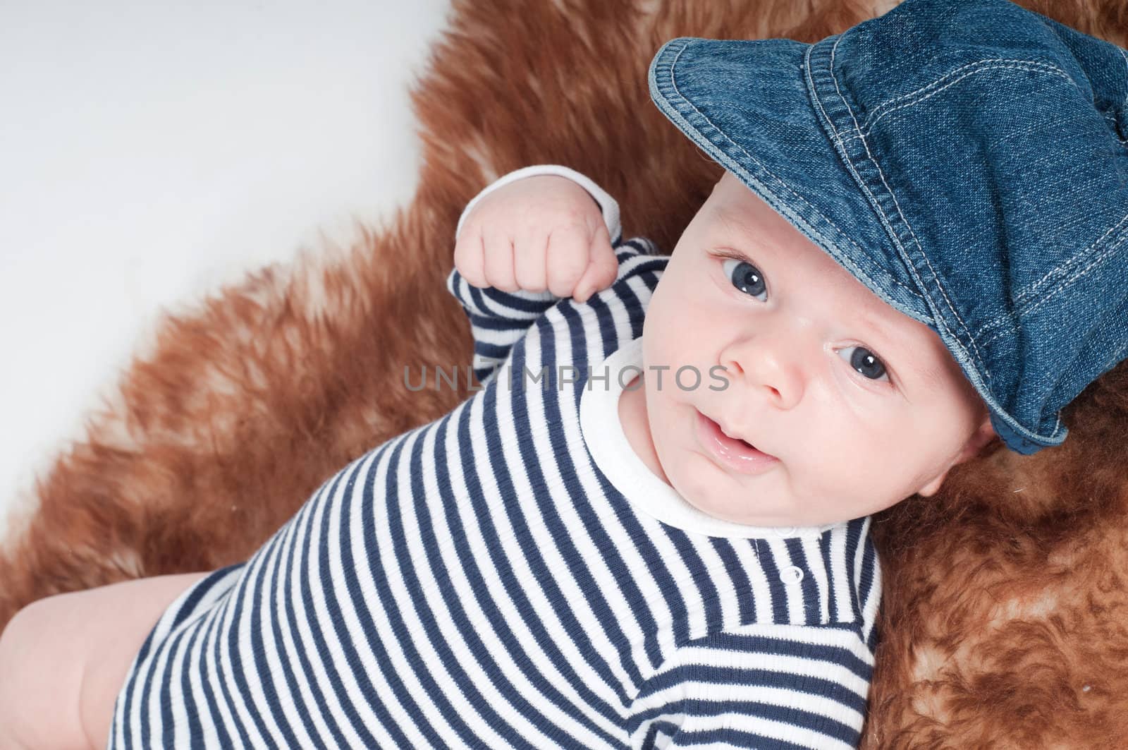 Shot of newborn baby lying on fur