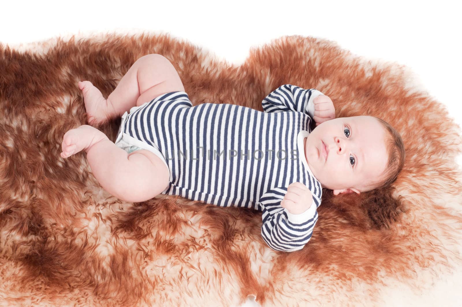 Shot of newborn baby lying on fur