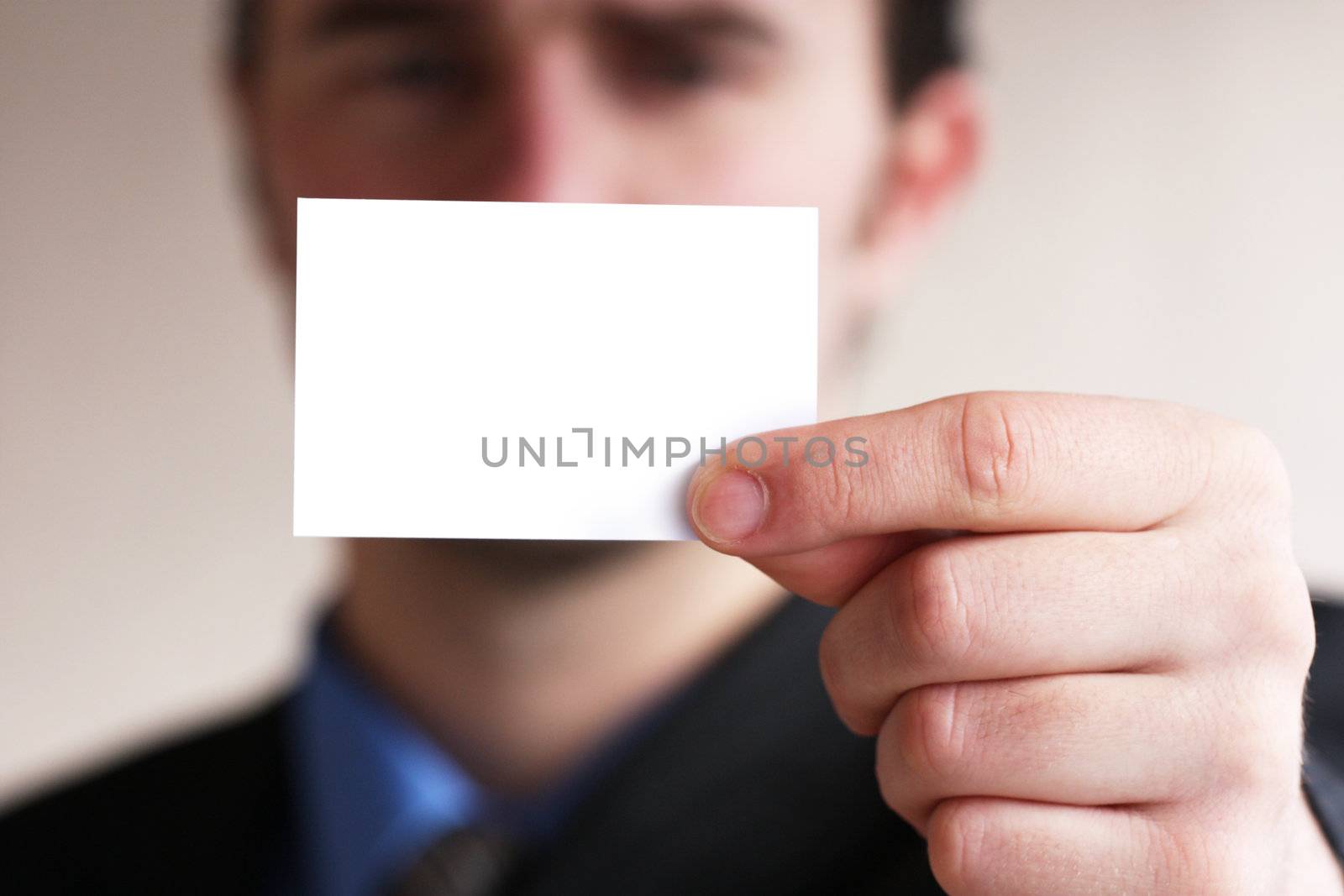 Businessman holding card by photochecker