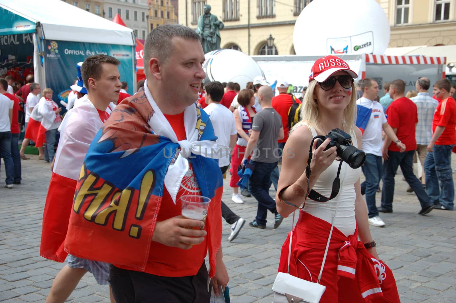 WROCLAW, POLAND - JUNE 8: UEFA Euro 2012, fanzone in Wroclaw. Russian couple visits fanzone on June 8, 2012.