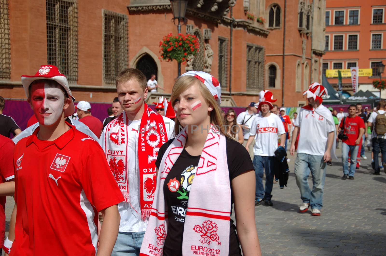 WROCLAW, POLAND - JUNE 8: UEFA Euro 2012, fanzone in Wroclaw. Young Polish fans go for first game on June 8, 2012.