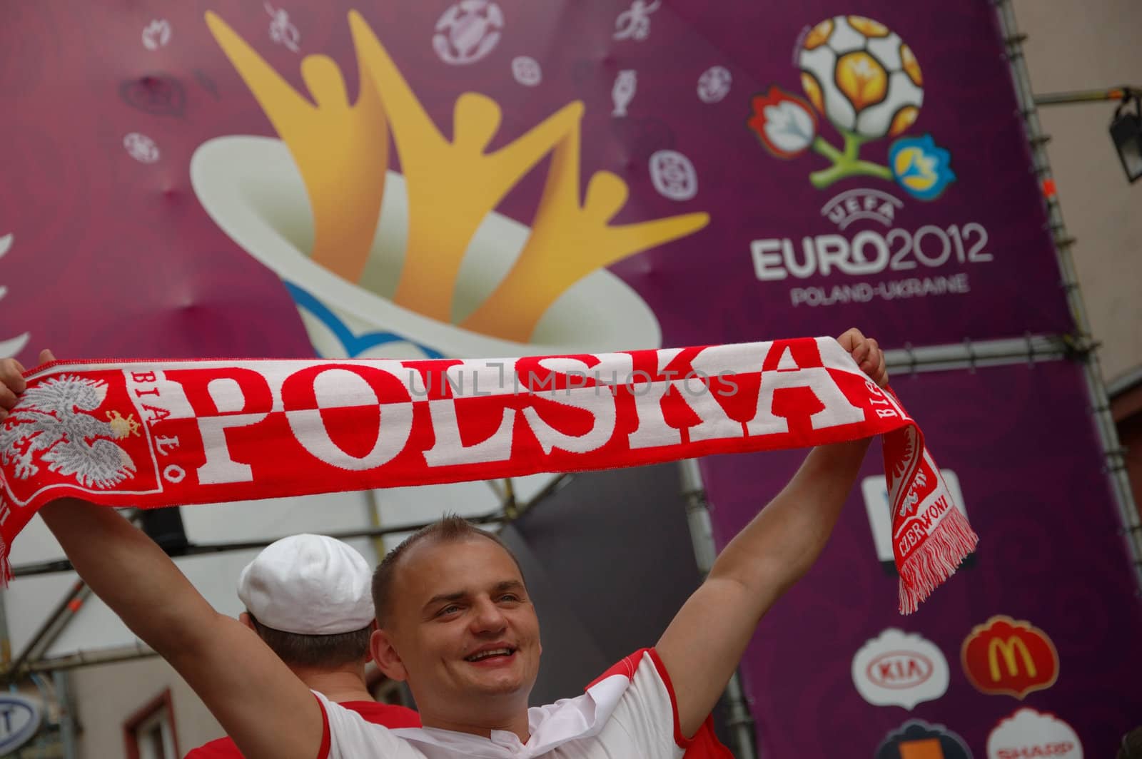 WROCLAW, POLAND - JUNE 8: UEFA Euro 2012, fanzone in Wroclaw. Polish football fan with neckerchief at entrance to fanzone on June 8, 2012.