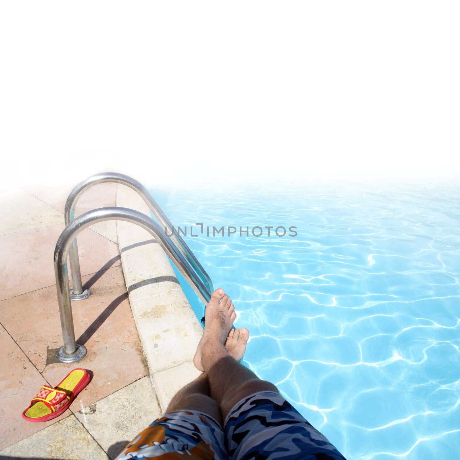 Swimming pool with ladder by photochecker
