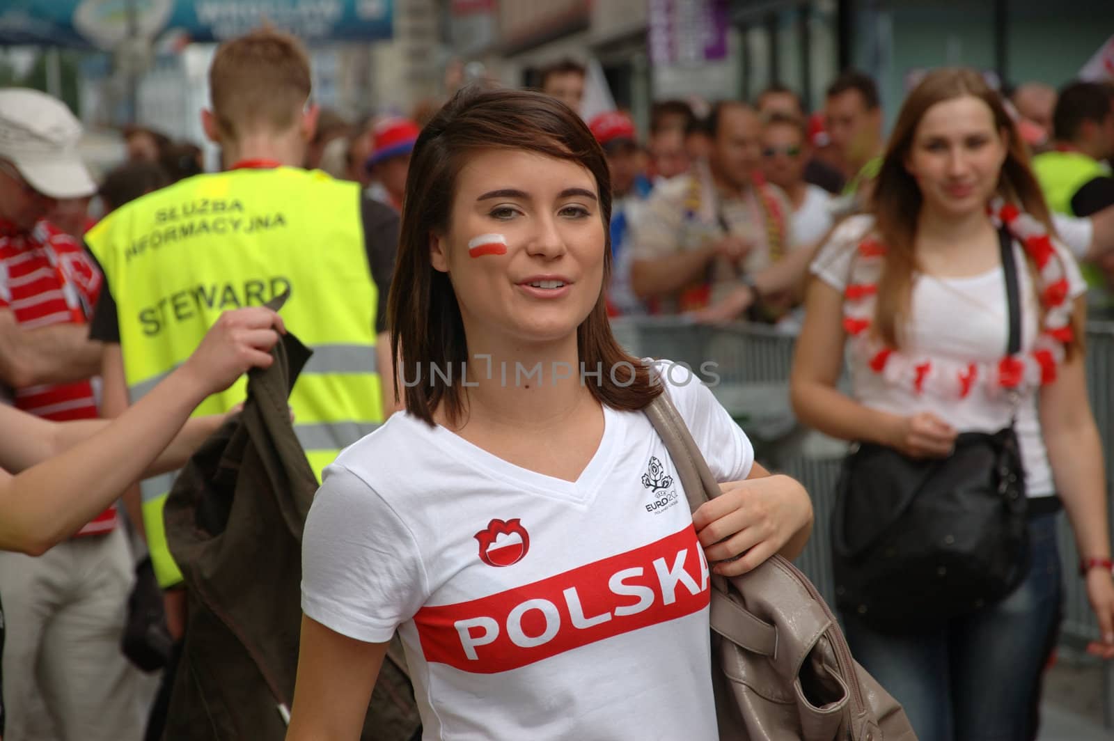 WROCLAW, POLAND - JUNE 8: UEFA Euro 2012, fanzone in Wroclaw. Charming Polish girl visits fanzone on June 8, 2012.