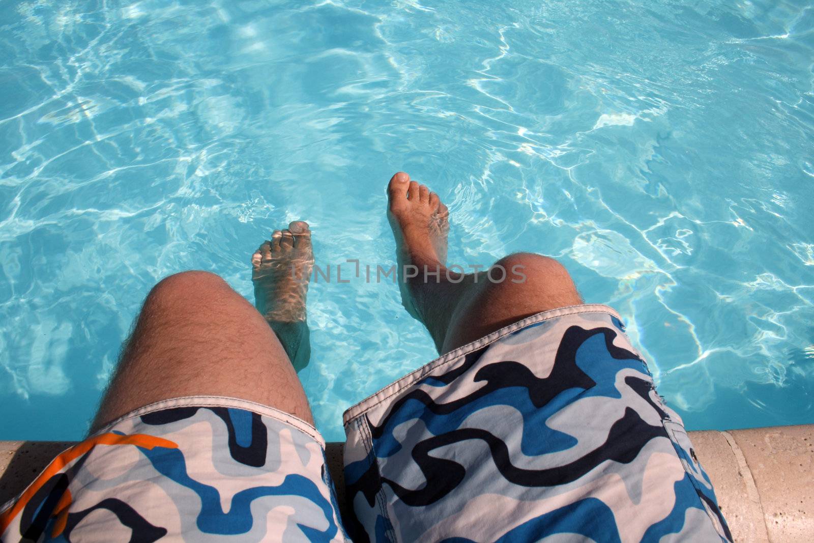 posing in the swimming pool for the photographer