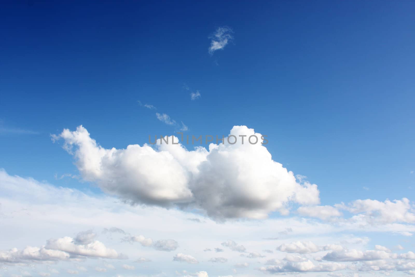 white clouds on blue sky in season