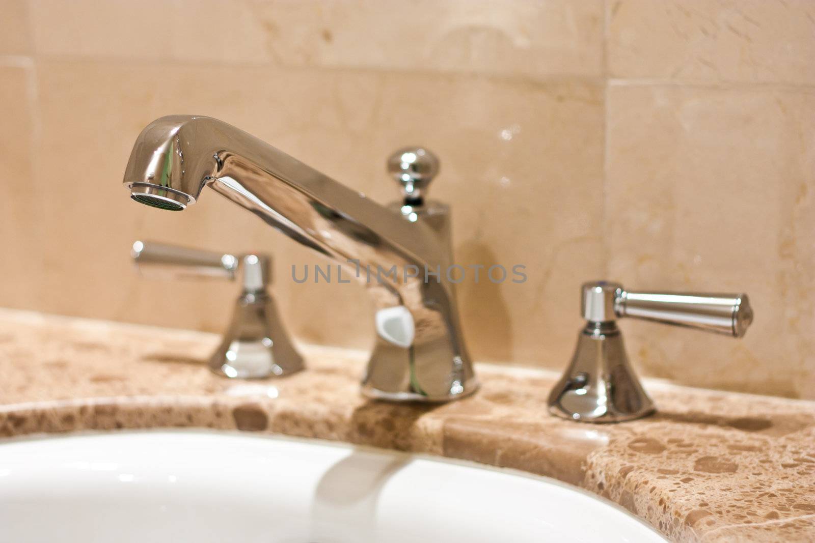 Tap in an Italian luxury hotel, steel on marble