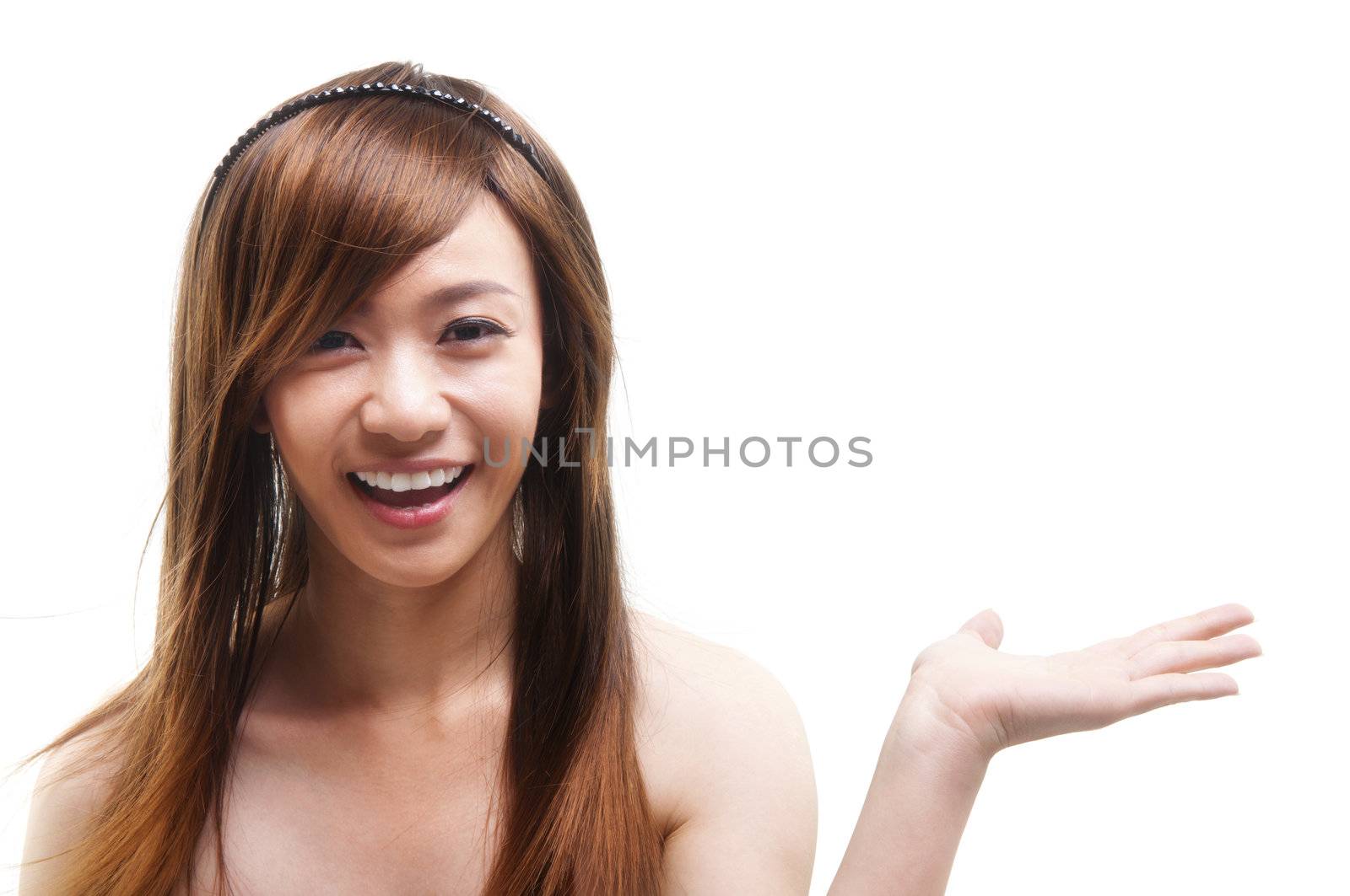 Cheerful young Asian arm out showing empty space, isolated on white