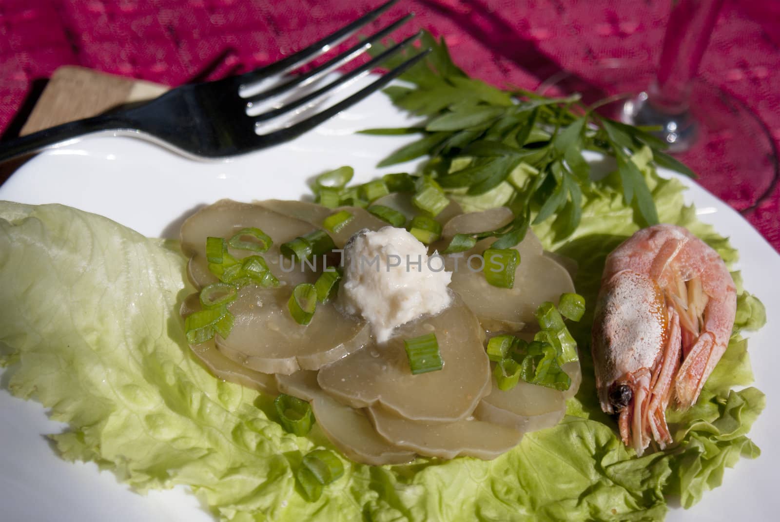 Easy snack from seafood and a marinaded cucumber with a sharp horse-radish