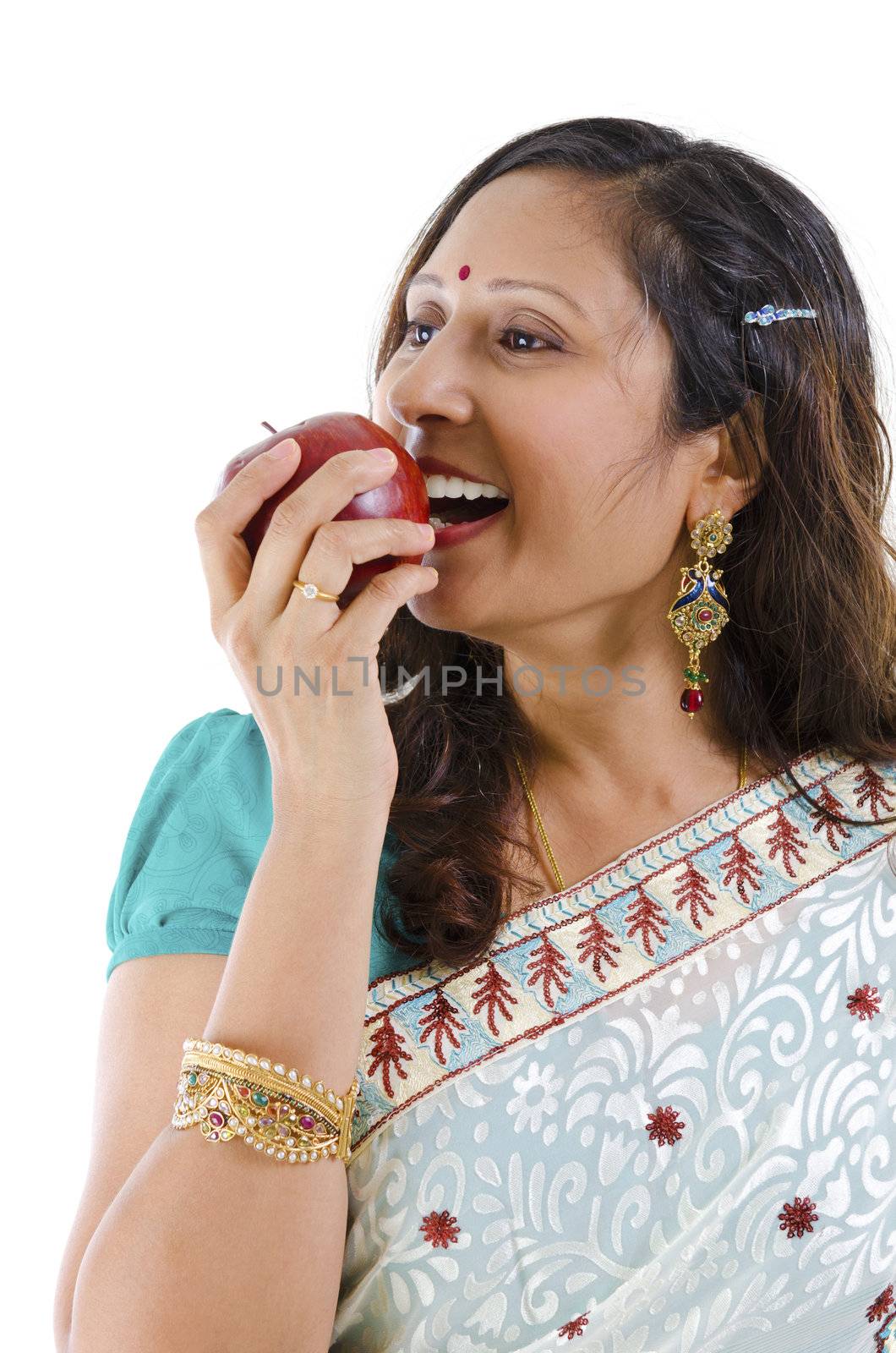 Healthy Indian woman eating red apple, isolated on white background