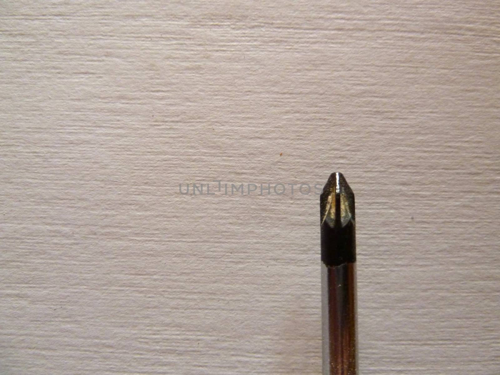 closeup of a screwdriver tip on white background