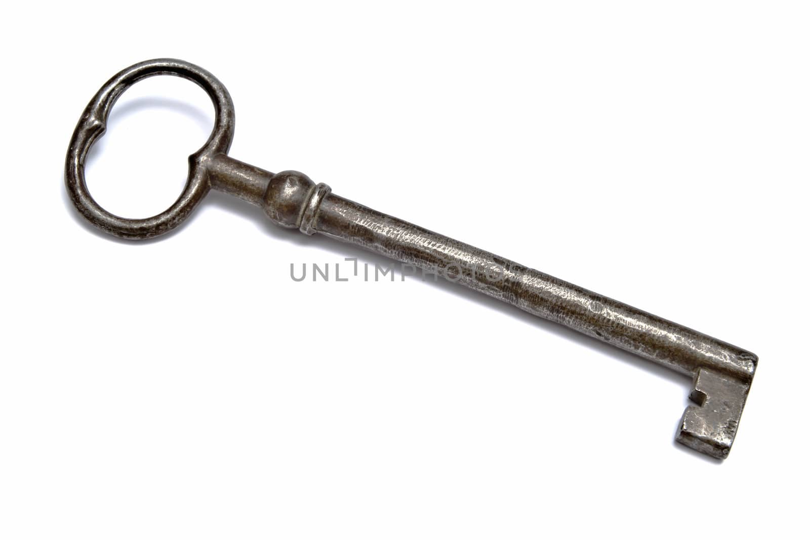 An old key closeup on white background