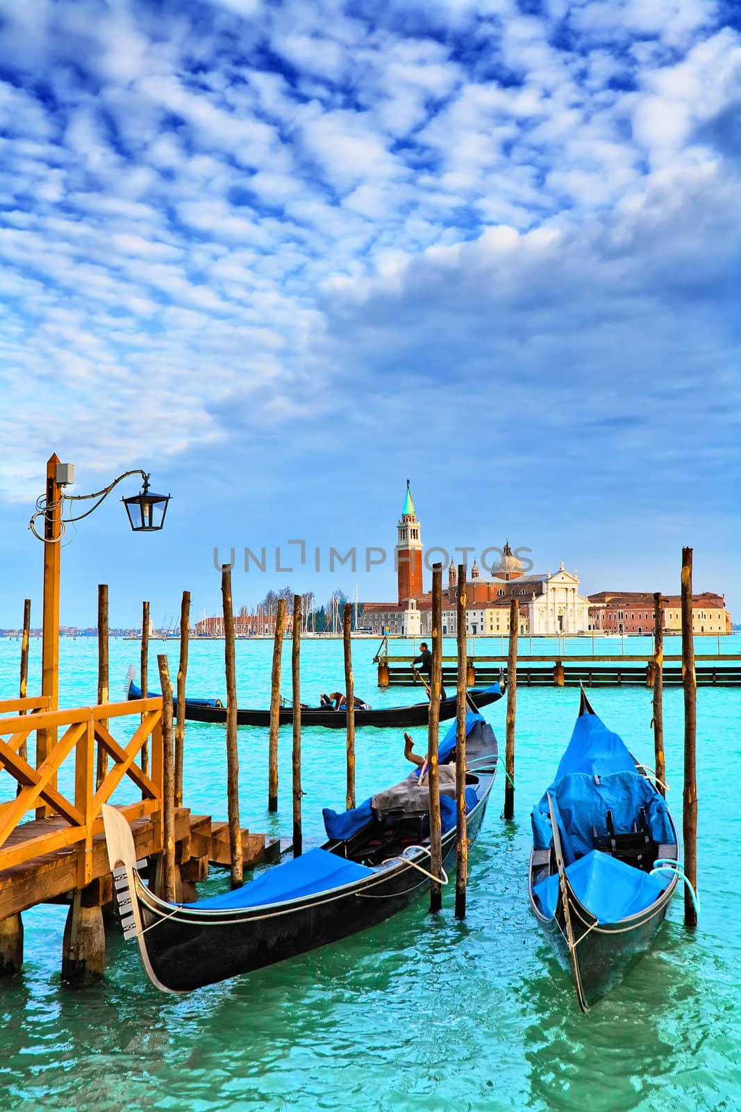  Gondolas. San Giorgio Maggiore. Venice. Venice is a city in northeast Italy which is renowned for the beauty of its setting, its architecture and its artworks. It is the capital of the Veneto region.