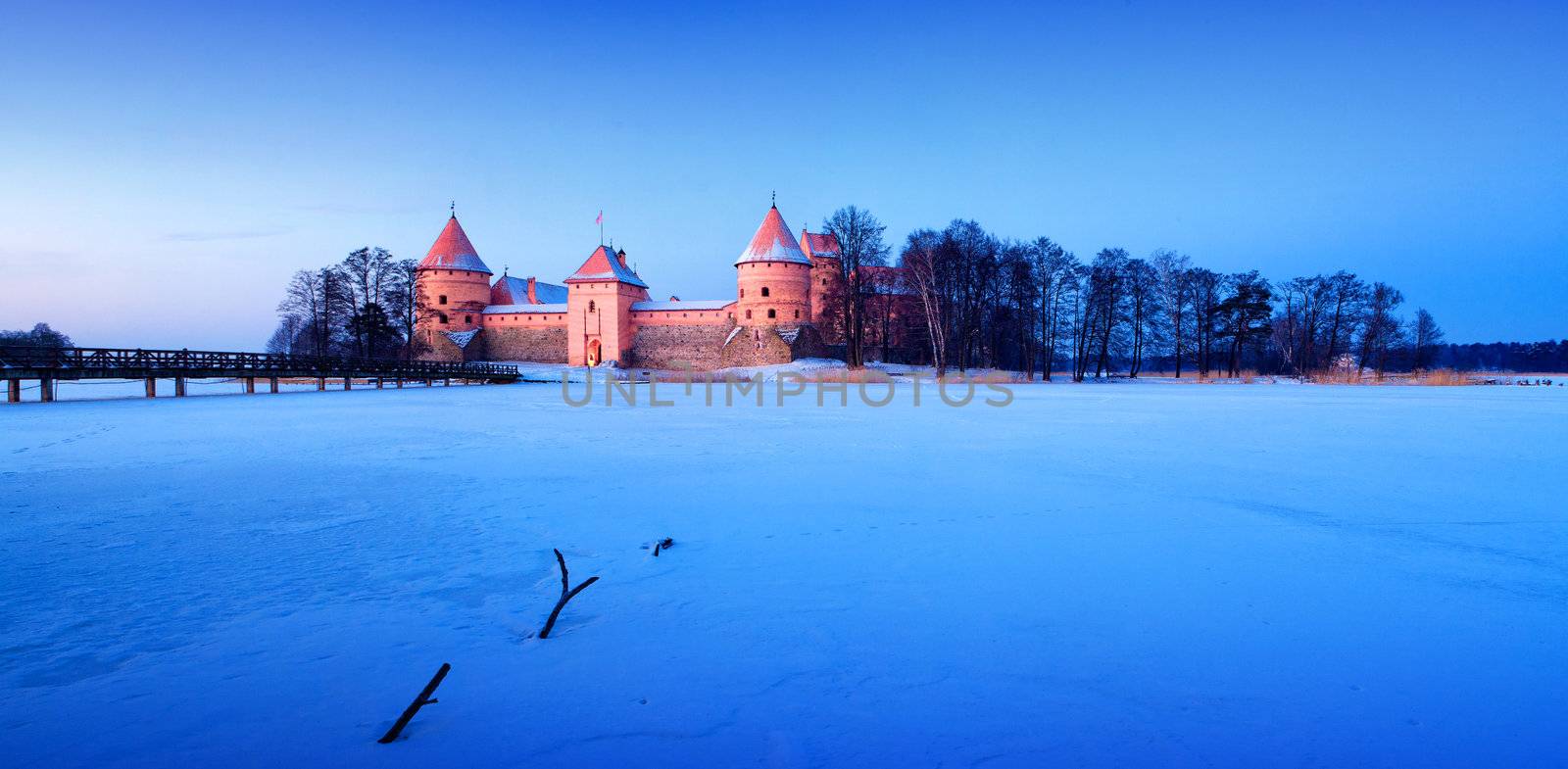 Trakai. Trakai is a historic city and lake resort in Lithuania. It lies 28 km west of Vilnius, the capital of Lithuania.   