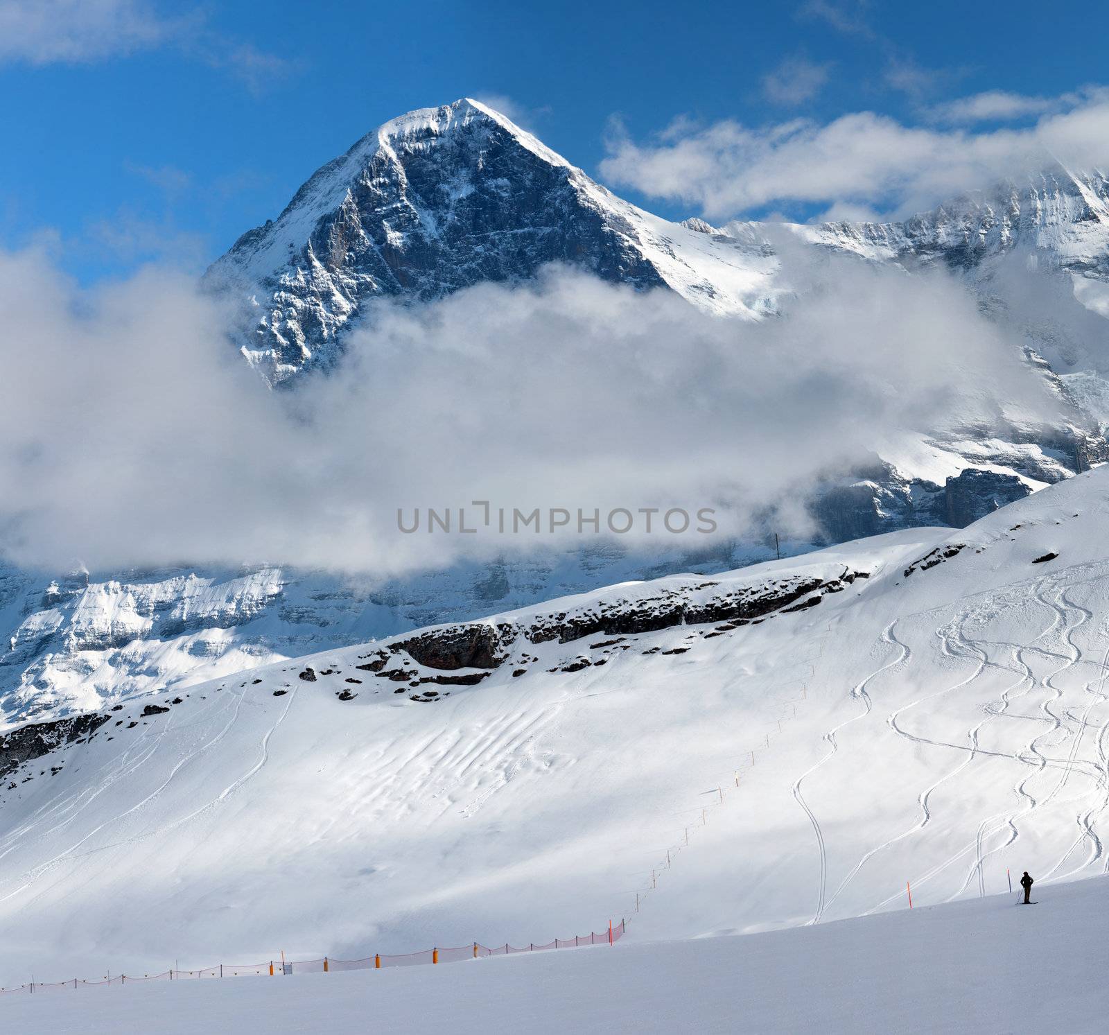 Ski slope in the background of Mount Eiger. The Eiger is a mountain in the Bernese Alps in Switzerland. Ski resort of Grindelwald.