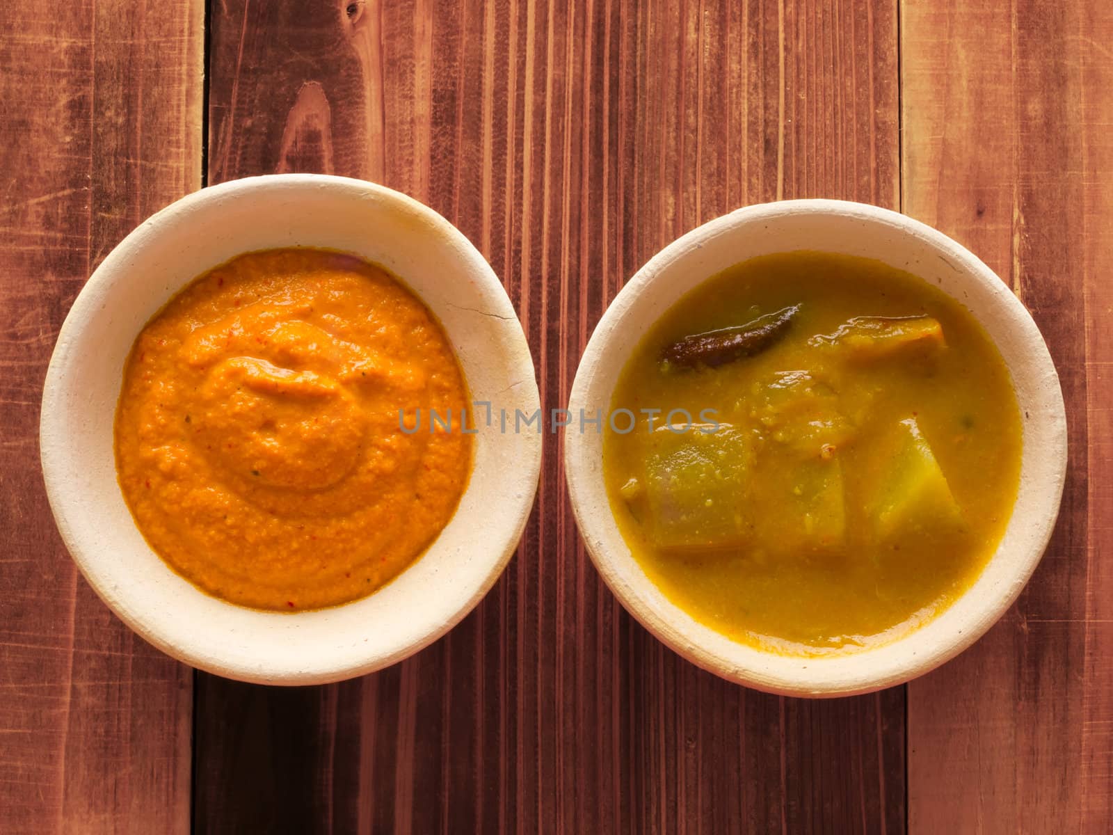 close up of bowls of traditional indian sauces