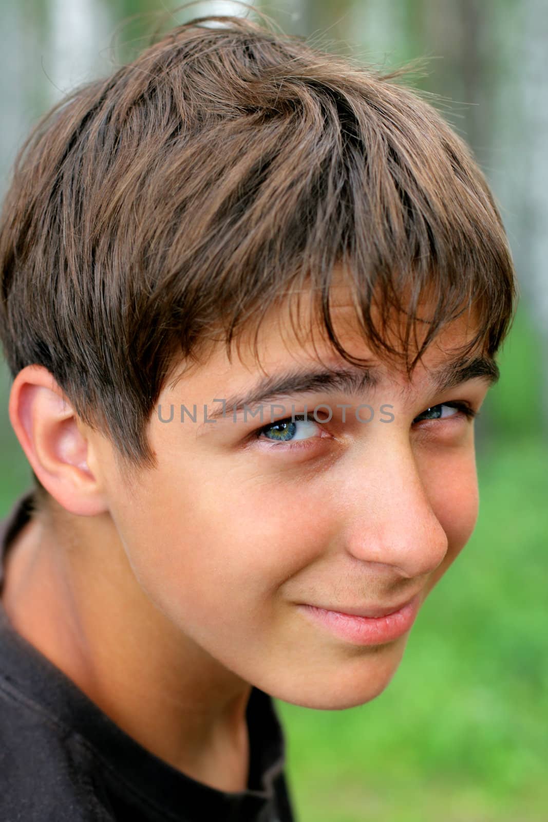 portrait of the smiling teenager outdoor