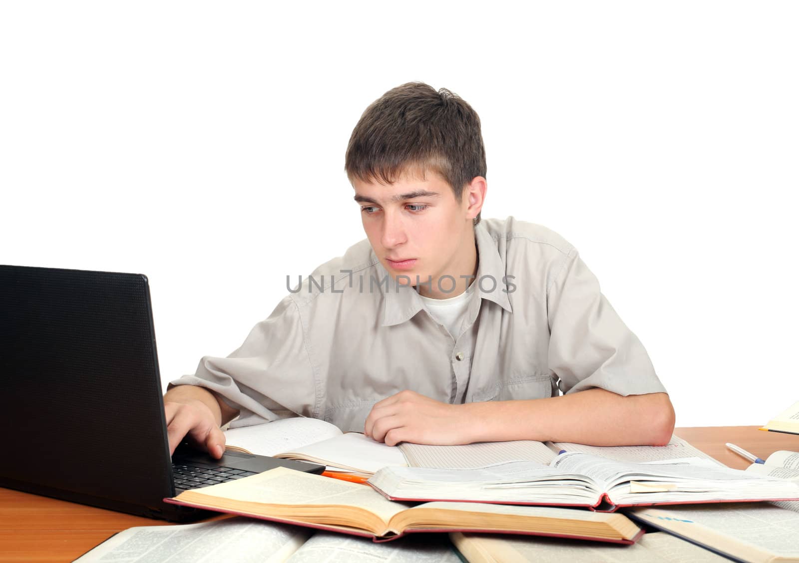 young male student working with many books on the table