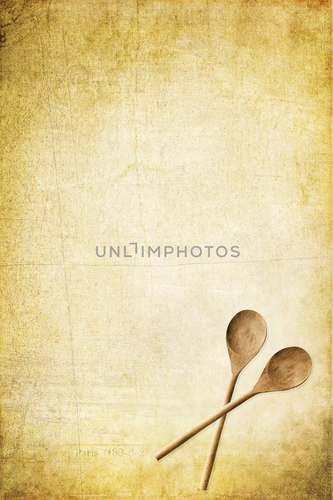 Grunge paper with wooden spoons and available copy space. Perfect for menus or recipes. 
